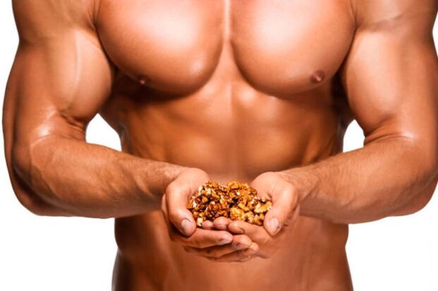 man holding walnuts for potency